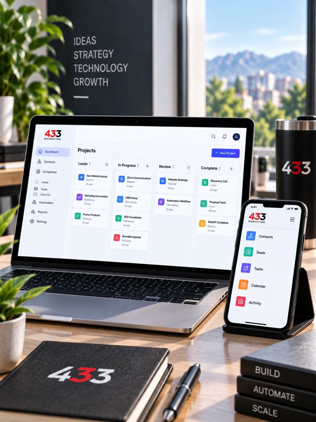 Business management software displayed on a laptop and phone