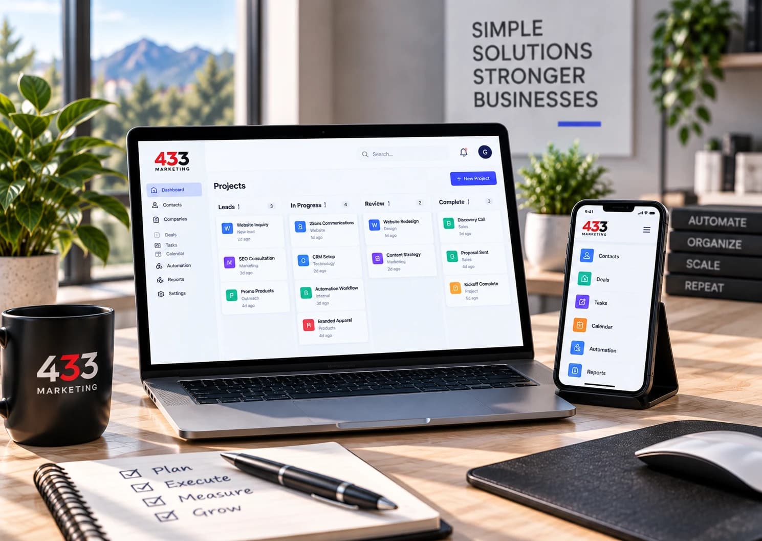 Project management boards on a laptop with a companion phone interface